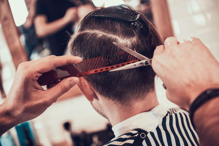 Stylish haircut for a man in a barbershop.の写真素材