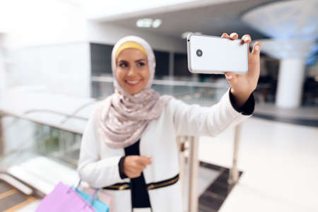 Young Arabian Woman Taking Selfie in Modern Mall.