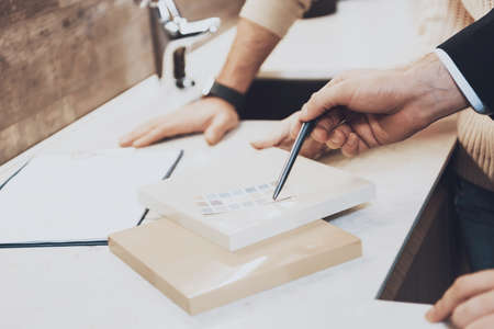 The seller shows strength of materials for buyers.