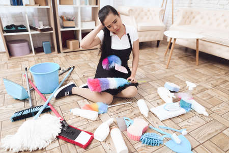 Asian woman tired of big house cleaning.の写真素材