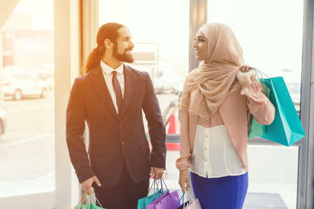 Young Arabian Couple Shopping in Modern Mall.