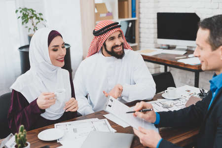 A man in a suit asks to sign the Arab.