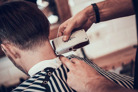 A man neck is shaved in a barbershop.の写真素材