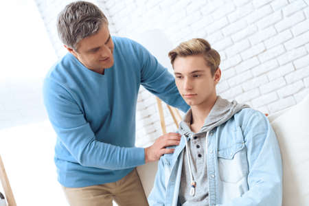 Relations between dad and son at home.の写真素材