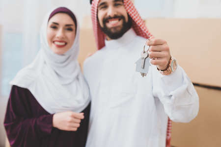Man and woman stand in a new apartment.の写真素材