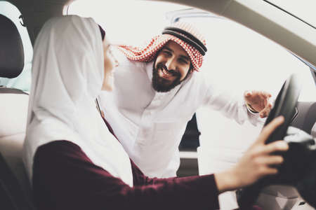 Arab man opens the door and looks at his wife.