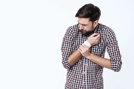 Man holding hand and feeling bad.
