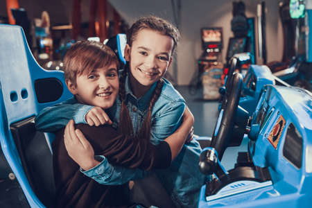 Sister hugs brother and congratulates him.の写真素材