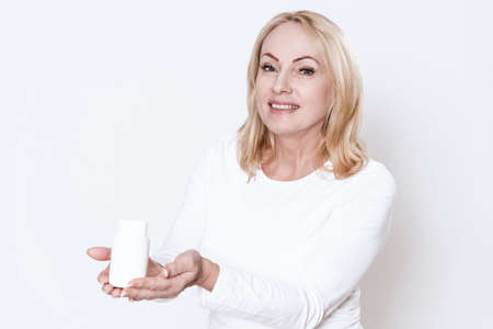 Woman held out her hands with the drug.の写真素材