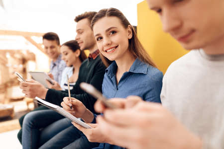 Woman records results of exploring application.
