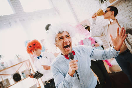 People in wigs have fun while at gay parties.の写真素材