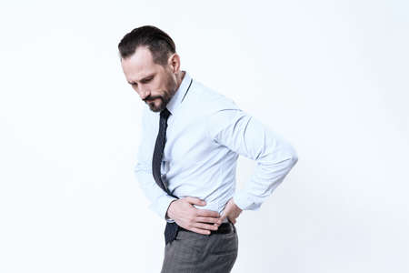 Man hold on to his side and feels severe pain.の写真素材