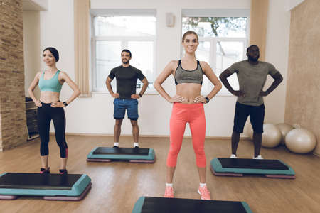 People are engaged in fitness in the modern gym.の写真素材