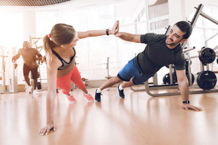 Girl doing exercises in a modern gym.の写真素材