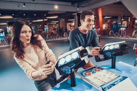 Woman holding on to game console in slot machines.の写真素材