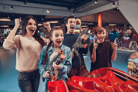 Family rejoices for playing well in a video game.の写真素材
