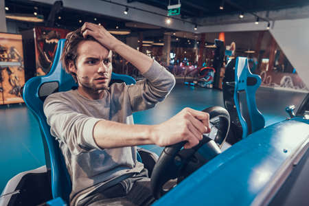 Man behind toy car in an entertainment center.の写真素材