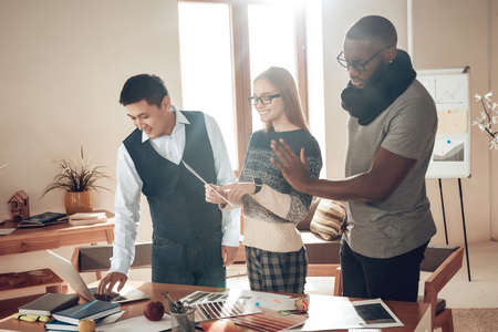 Black man showing stop gesture to colleagues.の写真素材