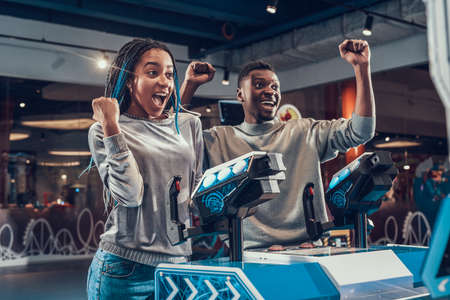 Girl rejoices and screams from winning the game.の写真素材