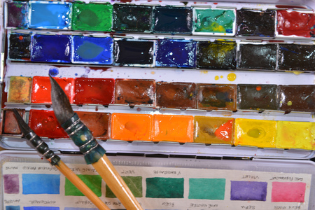 Box of watercolors with two brushesの写真素材