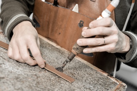 Trunk Maker at work in his luxury leather workshop, Franceの写真素材