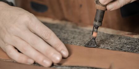 Trunk Maker at work in his luxury leather workshop, France