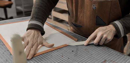 Trunk Maker at work in his luxury leather workshop, Franceの写真素材