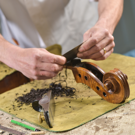 Craftsman working in workshop lutemaker, Violin makerの写真素材