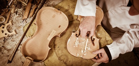 Craftsman working in workshop lutemaker, Violin makerの写真素材