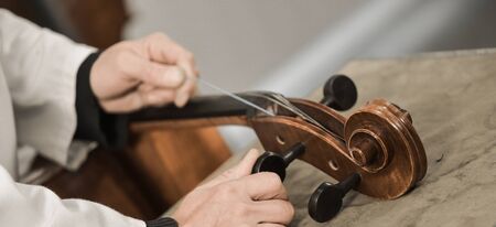 Craftsman working in workshop lutemaker, Violin makerの写真素材