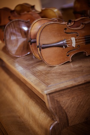 Close up shot of  violins in workshopの写真素材