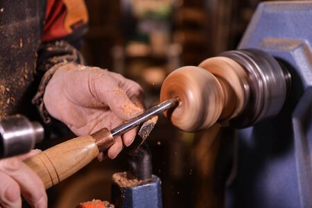 Woodturners using a rotating clamp to turn the wood, Franceの写真素材