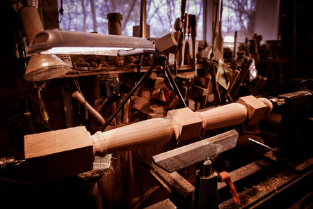Woodturners using a rotating clamp to turn the wood, Franceの写真素材