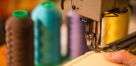 leather goods craftsman at work in his workshop, Franceの写真素材