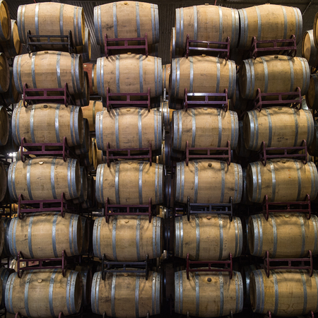 Wine barrels stacked in cellar, Bordeaux Vineyard, Franceの写真素材