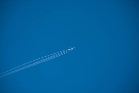 Shot of a jet plane high in the blue sky, France