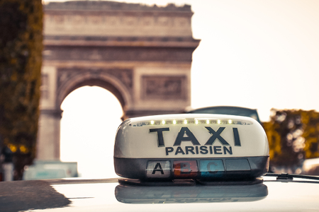 Paris taxi detail and Arc de Triomphe in the background, Franceの写真素材