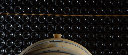 Underground wine cellar, Wooden barrels, bottles storage, Bordeaux Wineyard