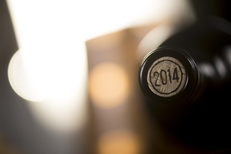 Close-up of closed wine bottles lying on blurry background, wineryの写真素材