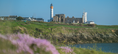 Abbey ruin and lighthouse, Pointe de Saint-Mathieu, Brittany, France, Europeの写真素材
