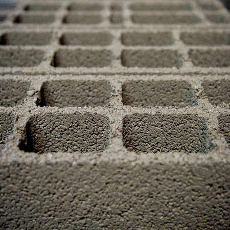 Fresh perpends aligned drying on the ground, breeze block