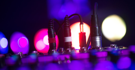 Audio jack Dj mixer dj mix music on the console the dj s hand , france