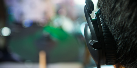 Back view of a young man listening music with headphones, Franceの写真素材