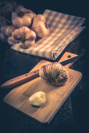 Garlic Cloves and Garlic Bulb on vintage wood background, Franceの写真素材