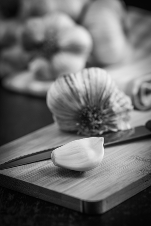 Garlic Cloves and Garlic Bulb on vintage wood background, Franceの写真素材
