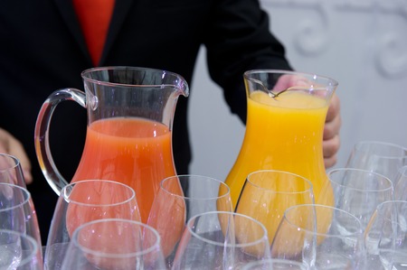 Pouring orange juiceの写真素材