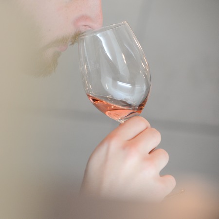 Tasting rose wine pour in a glass