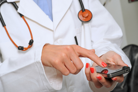Doctor using smartphoneの写真素材
