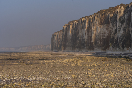 Cliff and Lighthouse at the entrance to the port of Saint Valery en Caux, Normandieの写真素材