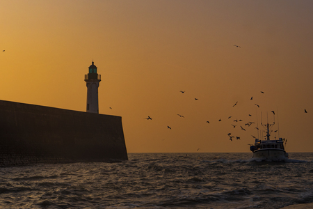 Cliff and Lighthouse at the entrance to the port of Saint Valery en Caux, Normandieの写真素材
